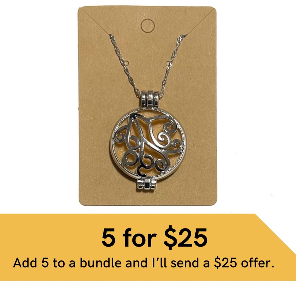 Essential oil diffuser locket on silver chain.